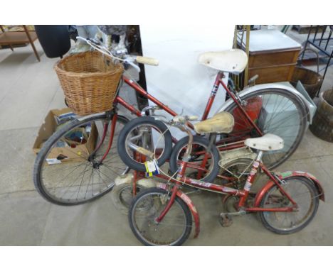 A lady's vintage bicycle and two children's bicycles