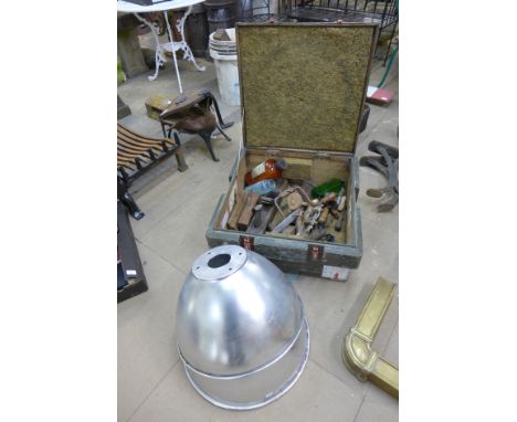 A wooden Royal Air Force box containing tools and a pair of industrial light shades