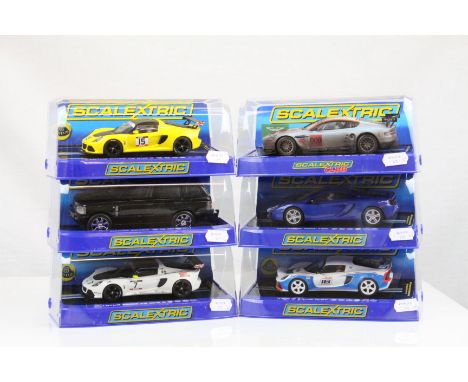 Six cased Scalextric slot cars to include C3509 Lotus Exige V6 Cup R Orange, C2878 Range Rover Black, C3513 Lotus Exige V6 Cu