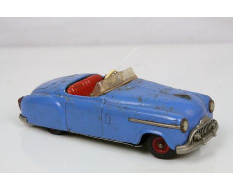 Original Schuco clockwork tin plate 4003 model motor car in blue with red hubs, with key, rusting and play wear