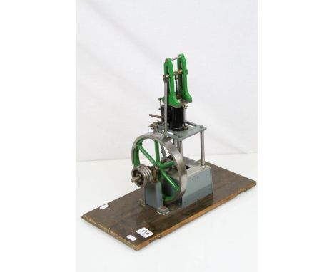 Stuart single cylinder live steam vertical engine, green and grey livery on wooden base, base measures 41 x 21cm and vertical