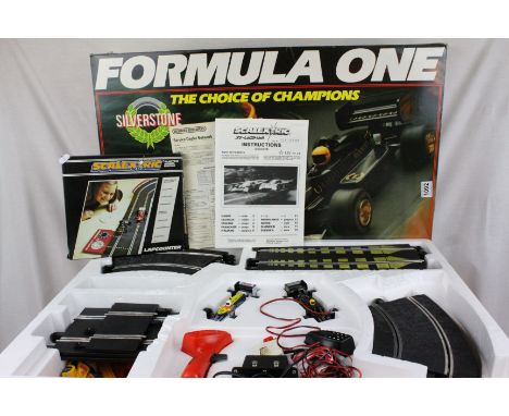 Boxed Scalextric C741 Formula One Racing Set with both slot cars plus a boxed Scalextric C277 Lapcounter (2)