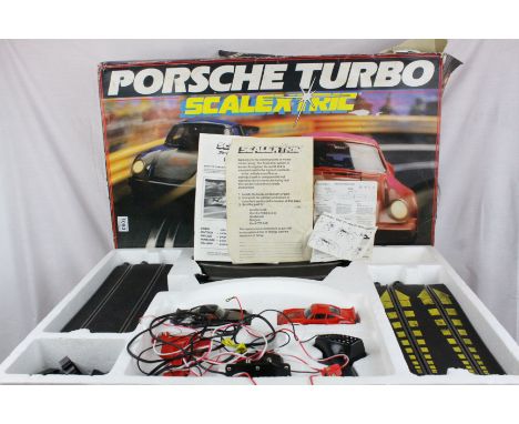 Boxed Scalextric C583 Porsche Turbo Racing Set with both slot cars, tear to box side, plus a box of track and accessories 