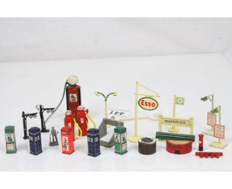 Group of mid 20th C diecast model railway and roadside accessories featuring Waterloo Station sign, ESSO sign, Telephone boxe