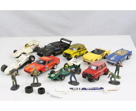 Seven play worn Scalextric slot cars to include Triang C83 Sunbeam Tiger in yellow, C122 Mini 1275 GT x 2 (yellow &amp; red),