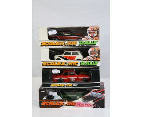 Four boxed Scalextric slot cars to include Rally x 2 (C110 Mini Clubman white &amp; C117 3.0 Ford Capri), C119 Porsche Turbo 