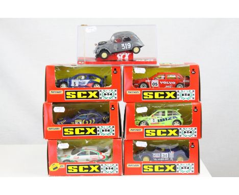 Seven boxed/cased Matchbox SCX slot cars to include 83750.20 Seat Ibiza Repsol, 83730.20 Toyaota Castrol, 82920.20 Volvo 850T