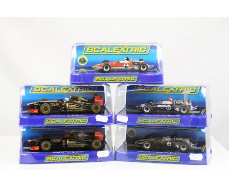 Five cased Scalextric Lotus slot cars to include C3262 F1 Team No 9 Kimi Raikkonen, C3261 F1 Team No 10 Romain Grosjean, C331
