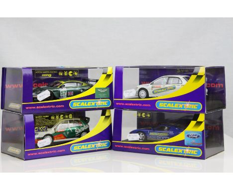 Four cased Scalextric slot cars to include C2816 Ford GT Scalextric Club 2007, C2682 Mitsubishi Lancer Evolution 7 WRC Collec