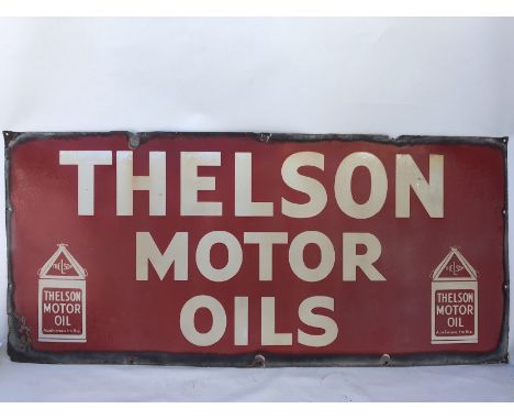 A rare Thelson Motor Oils rectangular enamel sign with image of a pyramid can to each end, 48 1/2 x 22".