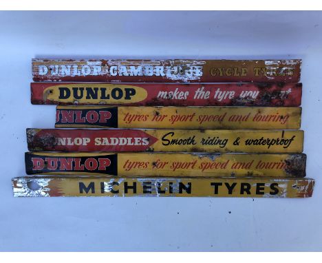 Five Dunlop shelf strips and a Michelin shelf strip.