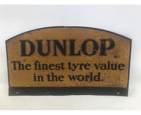 A Dunlop 'The Finest Tyre Value in The World' shaped tin pediment, 18 x 10 1/2".