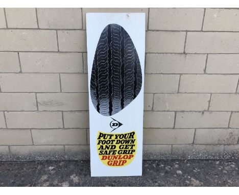A 1960s Dunlop hardboard advertising sign - Put Your Foot Down and Get Safe Grip, 16 x 48".