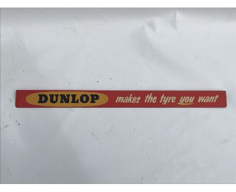 A Dunlop 'Makes the tyre you want' shelf strip, in good condition.