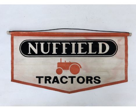 A Nuffield Tractors hanging banner with central pictorial tractor image, 22 x 11".