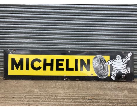 A Michelin rectangular enamel sign with image of Mr. Bibendum rolling a tyre to one end, 77 1/2 x 18". 