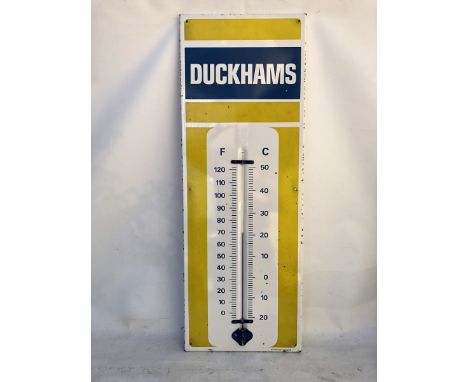 A Duckhams enamel thermometer by Burnham, 13 x 36".