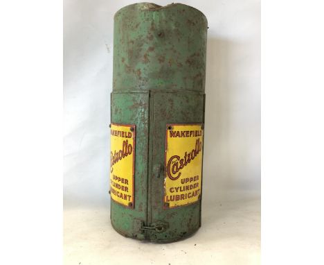 A Wakefield Castrollo Upper Cylinder Lubricant semi-circular wall mounted cabinet with good enamel signs to the front and ori