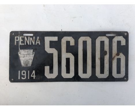 An early enamel numberplate dated 1914, for the area of Penna.