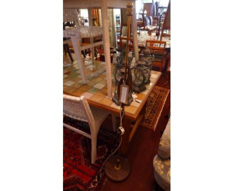 A mid 20th century teak and brass standard lamp 