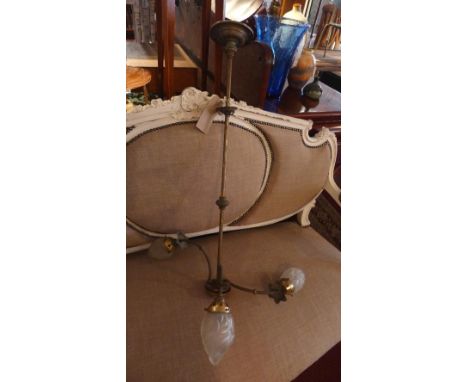 A three branch chandelier with flame shades 