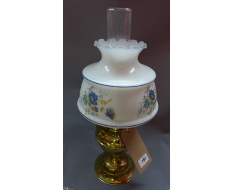 An early 20th century brass oil lamp, with opaque shade, having floral design 