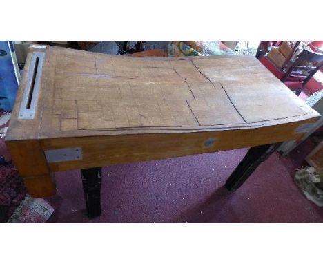 A large vintage butchers block, raised on ebonized legs, H.82 W.152 D.70cm 