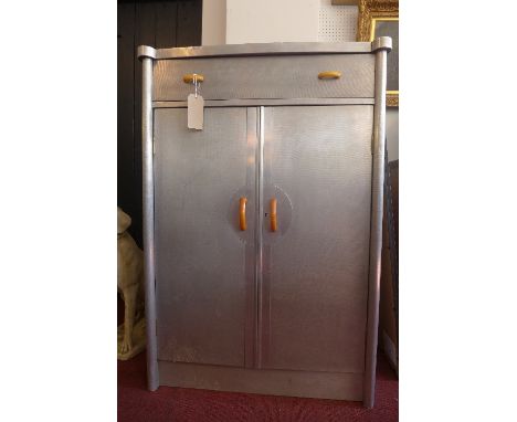 A 20th century Aviator wardrobe, designed by P.B. Cow & Co. Ltd, made by Hunting Aviation Ltd, having single drawer above two