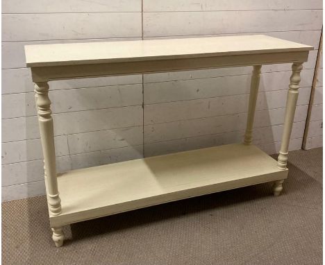 A white painted console table with turned supports and turned feet (H86cm W130cm D41cm)