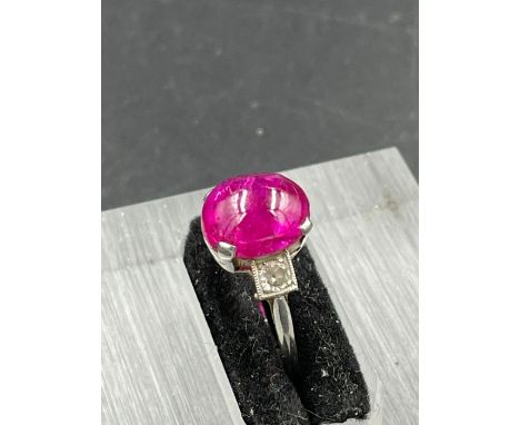 A vintage ruby on platinum ring with single stone diamond shoulders. Size L