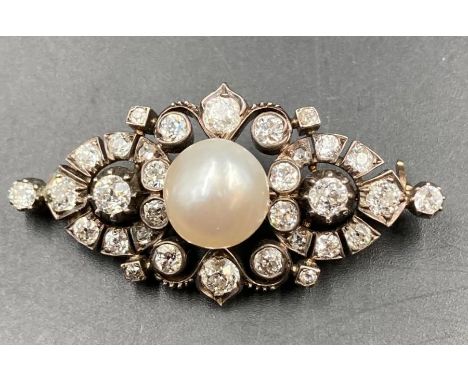 A Victorian 1880 silver and gold Pearl and Diamond brooch. Natural Salt Water pearl size 10.6 x 10.2 x 8.9mm