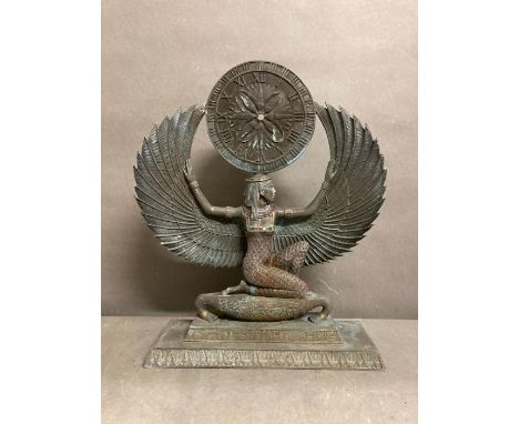 A mantle clock depicting the Egyptian goddess Isis, Time pieces missing 