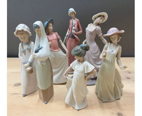 Seven Nao figurines, various style