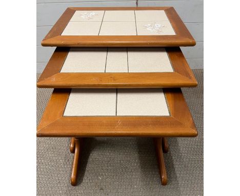 A nest of three Mid Century tile top tables (59cm x 43cm)