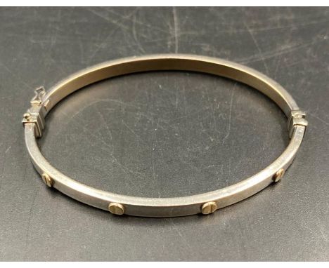 A 9ct white and yellow gold bangle (Approximate Total Weight 6.8g)