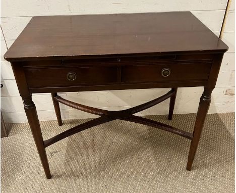 A mahogany side table and writing shelf with tapering legs and cross stretchers (H74cm W83cm D48cm)  