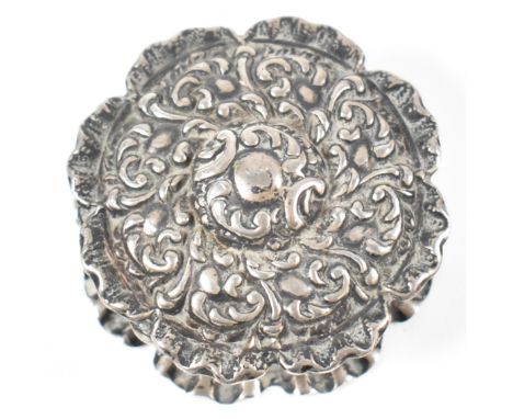 An Edwardian hallmarked silver pill / snuff box. Roundel form cast in repousse. Hallmarked Birmingham 1902, sponsors mark for