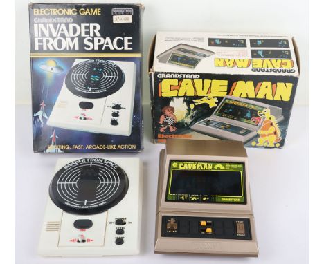 Two Boxed Vintage Grandstand Electronic Games. Including Cave Man Complete with instructions in working order. Invader From S