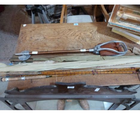 A collection of split cane fishing rods and a shooting stick