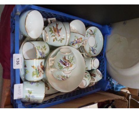 A 19th century part tea service, painted with birds and gilded. 26 pieces