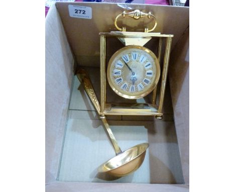 A German gilt plated mantle clock with jewelled movement, 6'' high and a gilt plated ladle