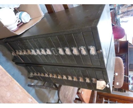 A pair of 15 drawer metal cabinets containing tools and sundries