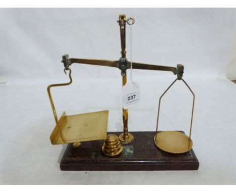 A set of Victorian brass postal scales marked Degrave Short Panner & Co. London incuse 10' wide