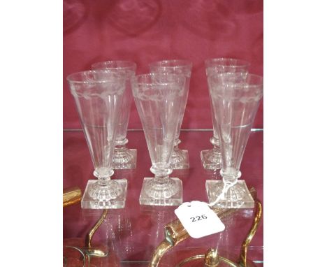 A Victorian set of six ale glasses, the wheel engraved tapered bowls on lemon squeezer square bases. One base with ground chi