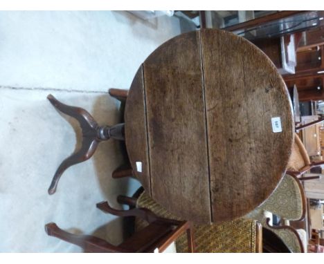A 19th century oak snap-top tripod table 23½' diam. (A.F.)