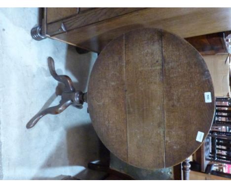 A 19th century oak snaptop tripod table 34' diam.