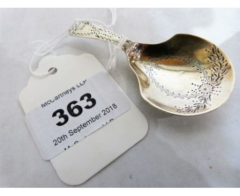 A George III silver caddy spoon with bright cut decoration. 2?' long. London 1970