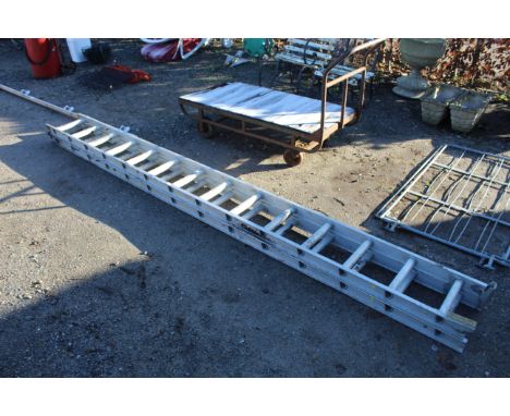 An extending aluminium ladder measuring approx. 139" when closed 