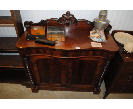 A mahogany serpentine fronted chiffonier 
