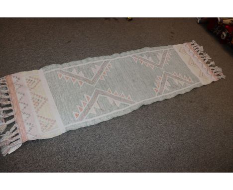 An approx. 7'9" x 2'4" Weaver Green Paloma patterned runner 